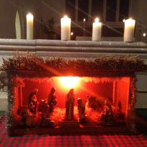 The nativity stable lit with candles
